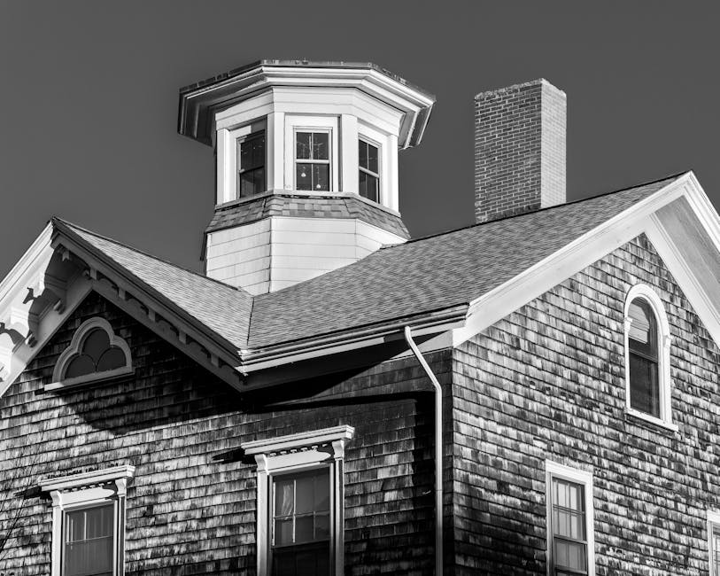 Completed roof replacement with new shingles on residential home showing quality workmanship