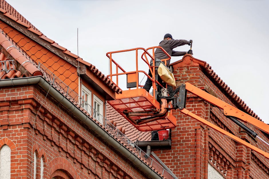 Professional roofer with safety equipment during installation